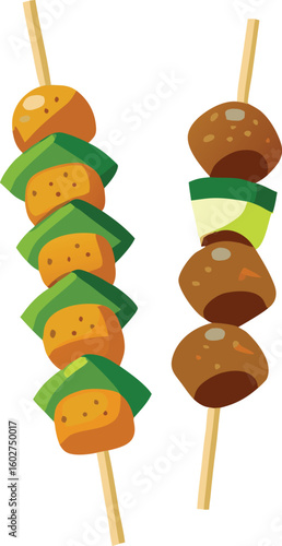 Orange and brown food skewers with green leaves meat vegetables