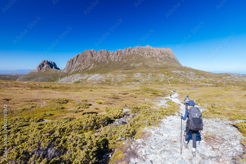 Fototapeta premium Hikers at Cradle Mountain in Tasmania Australia