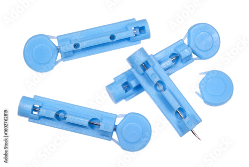Foto Disposable lancets draw blood for testing on white background