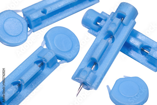 Картината върху платно Blue disposable sterile lancets for blood draw close up