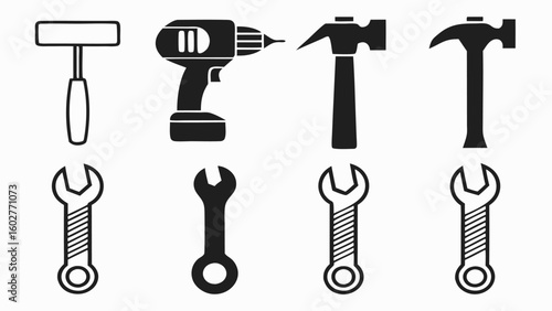 Collection of hand tools including hammers drill and wrenches