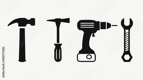 Collection of silhouetted hand tools including hammer drill and wrench