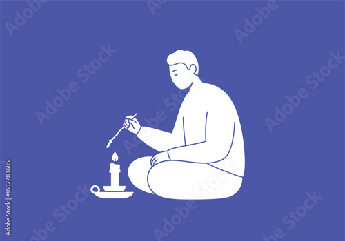 Man meditatively lights a candle, peaceful evening ritual.