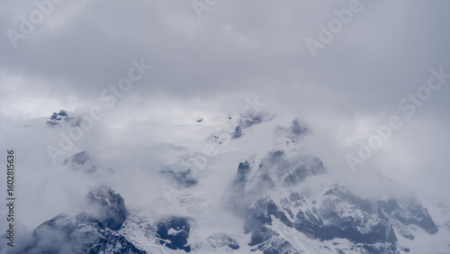 Majestic Svinafellsjokull Glacier shrouded in clouds during a moody Icelandic day