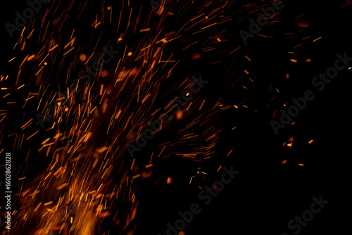 A black background with a lot of orange sparks