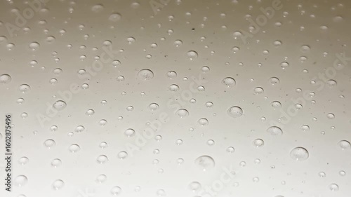 Abstract water drops on a white background, macro. Bubbles close-up. Drops of cosmetic liquid. Flat pattern. Condensation from water.