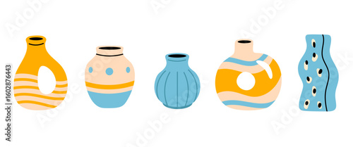 Collection of colorful ceramic vases in yellow and blue tones with abstract shapes and modern designs