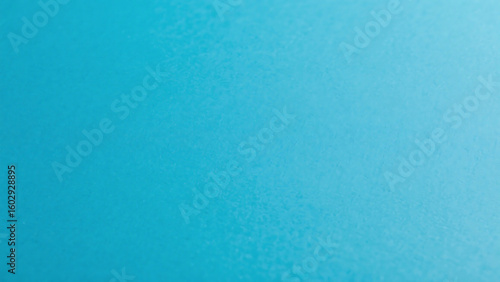 A simple light blue background with a gradient from light to dark on the right side of the image