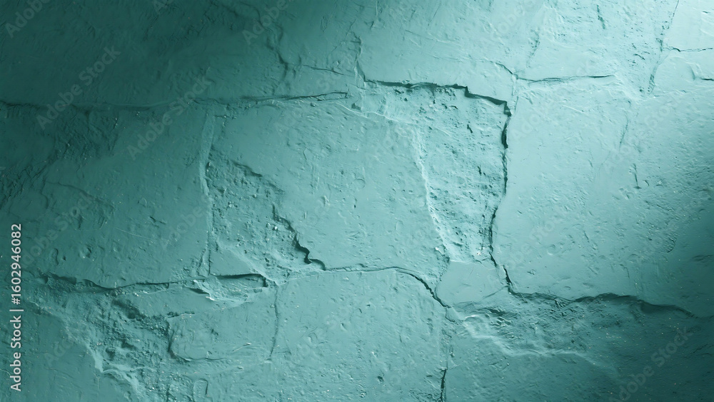 Fototapeta premium A close up of a textured teal wall with cracks and uneven surfaces under soft lighting conditions