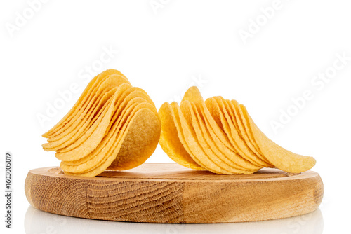 Crispy potato chips isolated on white background, close-up.