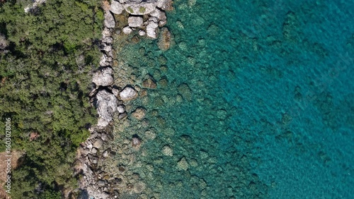 Aerial View of Secluded Beach Cove with Turquoise Waters in Mani Peninsula, Peloponnese, Greece, Delfinia beach