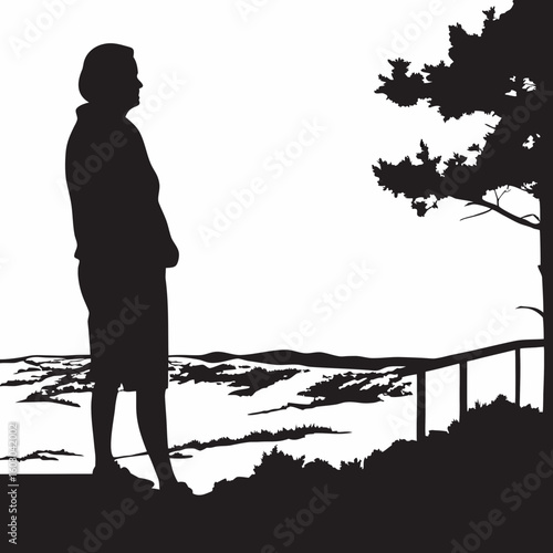 Silhouette of a woman admiring the landscape at sunset