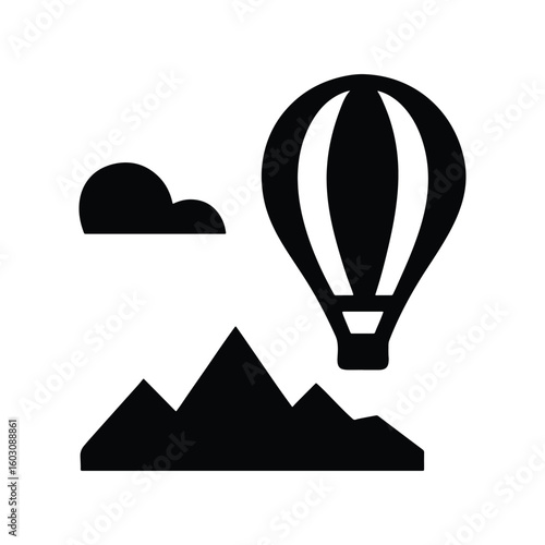 Hot air balloon gracefully floating above rolling hills at sunset