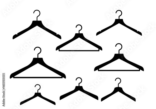 Collection of Black Clothes Hangers Arranged Artistically on a White Background Demonstrating Wardrobe Organization Essentials