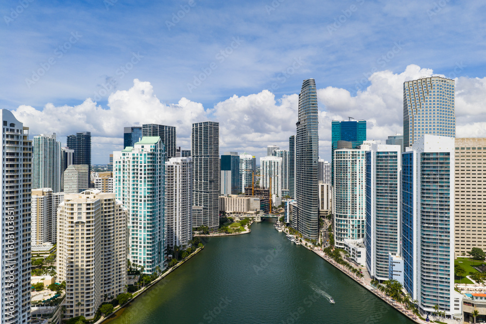 Fototapeta premium Drone view of Brickell skyscrapers. Brickell cityscape of downtown Miami. Panoramic Miami Brickell skyline above the coastline. Brickell Key aerial view in Miami. Landscape of Miami.
