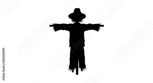 A spooky scarecrow silhouette in the field. 