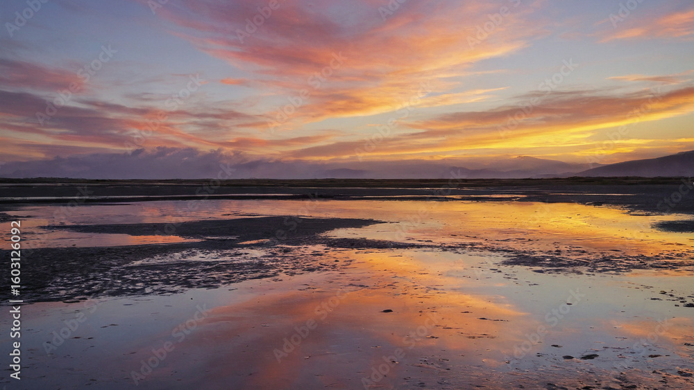 Fototapeta premium Sunset reflecting on tidal flats