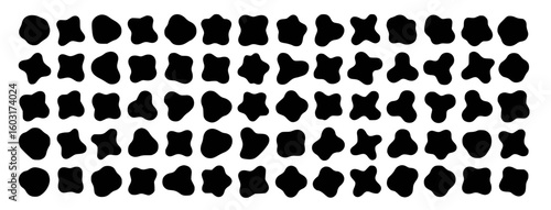 Black organic blobs scattered on white background abstract organic shapes