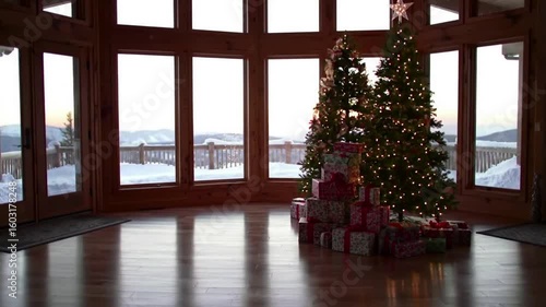 Christmas morning anticipation in cozy cabin with mountain views and sparkling Christmas trees