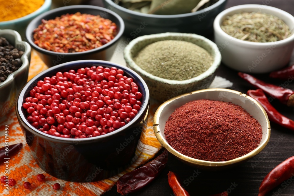 Different aromatic spices on wooden table, closeup Different aromatic spices on wooden table, closeup