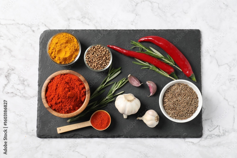 Different aromatic spices on white marble table, flat lay Different aromatic spices on white marble table, flat lay