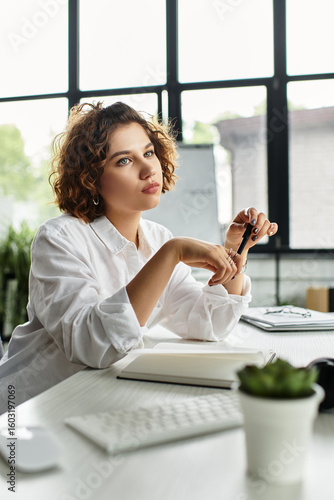 Young businesswoman reflects thoughtfully at her modern office desk during summer Free Download Young businesswoman reflects thoughtfully at her modern office desk during summer - GFXLoad