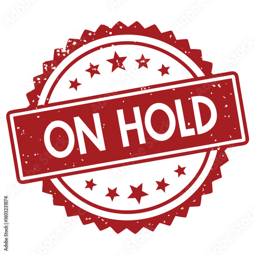 A distressed red stamp shows the phrase on hold against a white backdrop