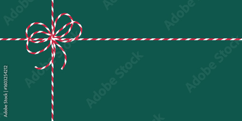 Christmas background with red white striped ribbon bow on dark green. Gift box backdrop. Perfect for holiday card, banner, packaging, gift wrap, invitation, seasonal web graphic, poster, digital ads