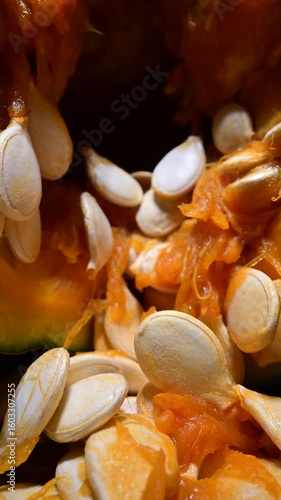 Cutting orange pumpkin with seeds close up. Food photography