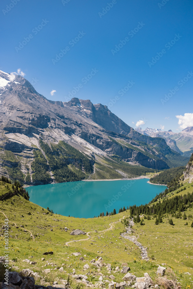 Obraz premium Lake Oeschinen in Switzerland, beautiful swiss mountain lake and world heritage. Panorama view of the lake.