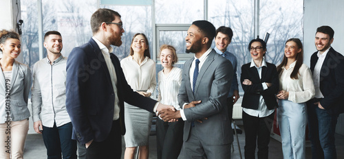 Fotografija CEO manager congratulating successful worker after meeting with staff, two men s