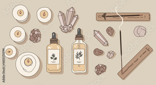 Calm workspace with tea, essential oils, prayer beads, and candle 