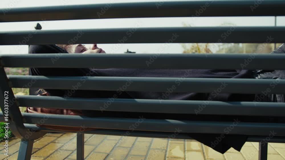 Outdoor Bench Is The Perfect Place To Sleep For A Young Man Outdoor Bench Is The Perfect Place To Sleep For A Young Man