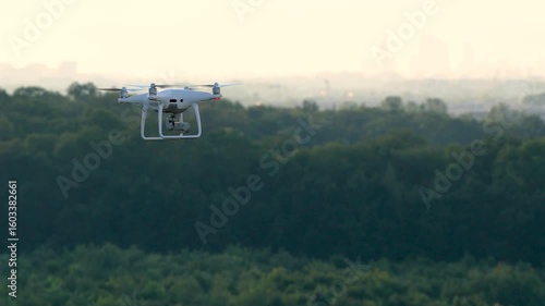 Aerial footage captured by a drone filming another drone high above the cityscape, showcasing stunning urban views and dynamic sky perspectives
