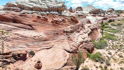 Aerial White Pocket Sandstone Formation Fly Over With Dramatic Desert Landscape