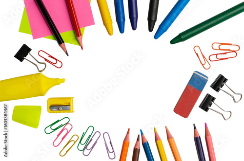 Colorful school and office supplies arranged in a circle on transparent background with central copy space for design. 