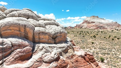 Aerial White Pocket Rock Formations and Desert Fly Through Motion