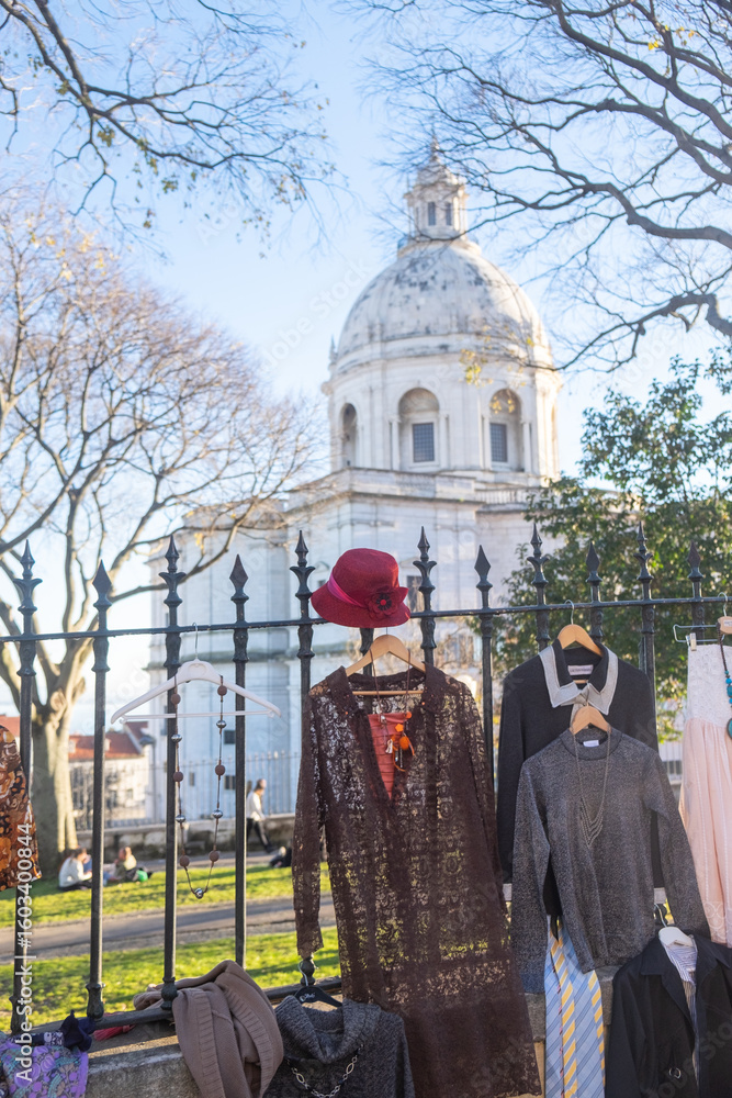 Naklejka premium Flea Market Clothes and Hat Display