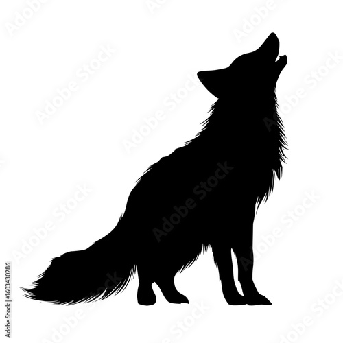 Silhouette of a howling wolf on a city skyscraper