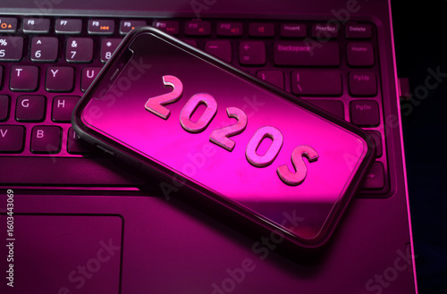 Cell phone with metallic text reading 