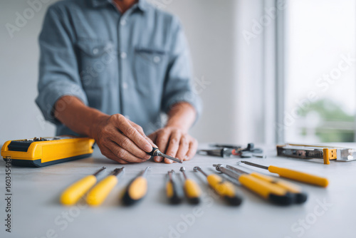 professional technician skillfully repairing household appliances using various tools on clean background