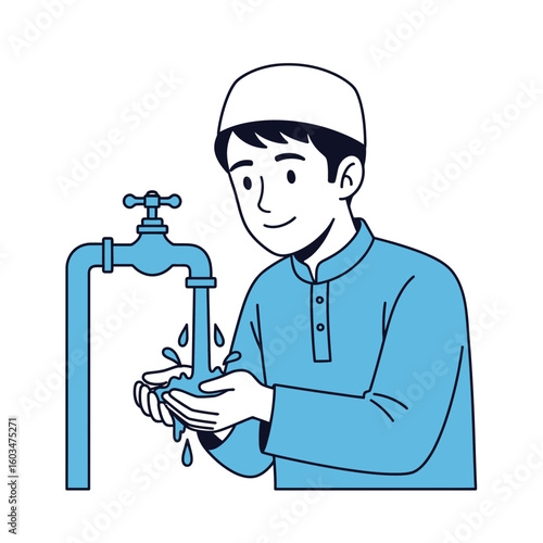 A young Muslim man wearing a taqiyah is washing his hands under a water tap, preparing for prayer.