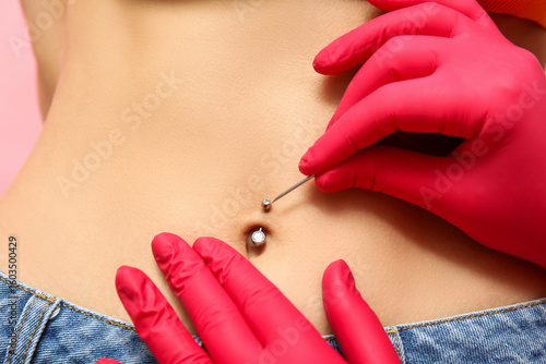 Professional doing piercing...