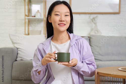 Young Asian woman sitting o...