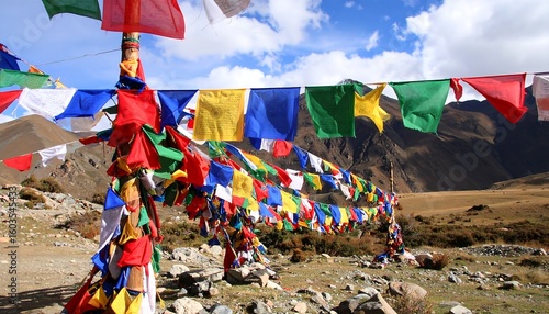 Colorful prayer flags fluttering in a mountain landscape