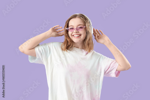 Cool young woman listening ...