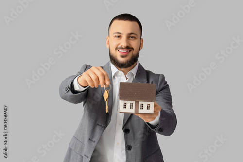 Male real estate agent with...