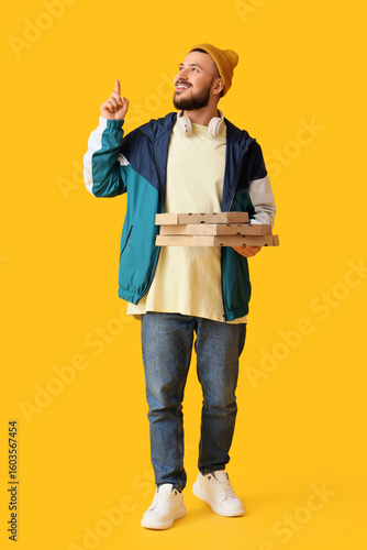 Male courier with pizza box...