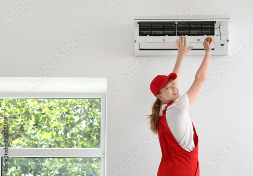 Female technician repairing...