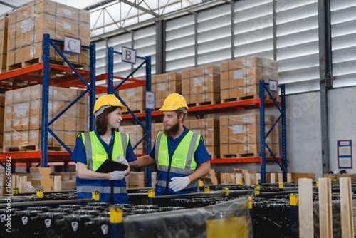 Canvastavla Automotive logistics team ensures accuracy in stock control at industrial parts warehouse, working safely under a structured supply chain environment